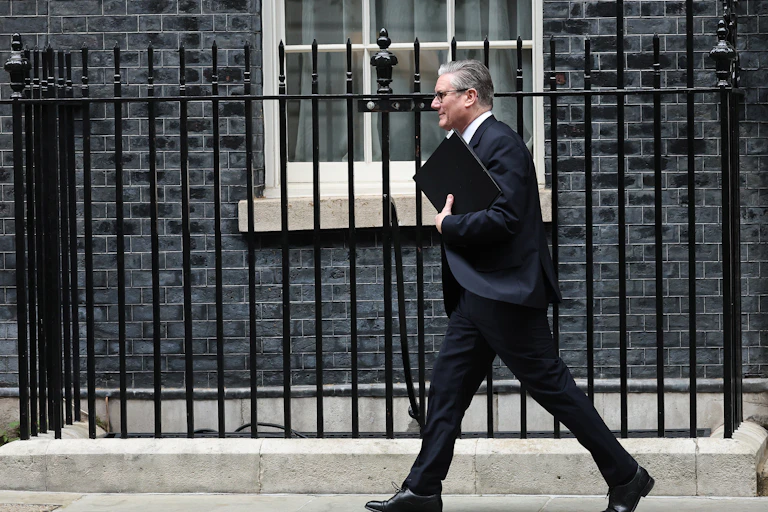 Starmer walking in front of Number 10 Downing Street