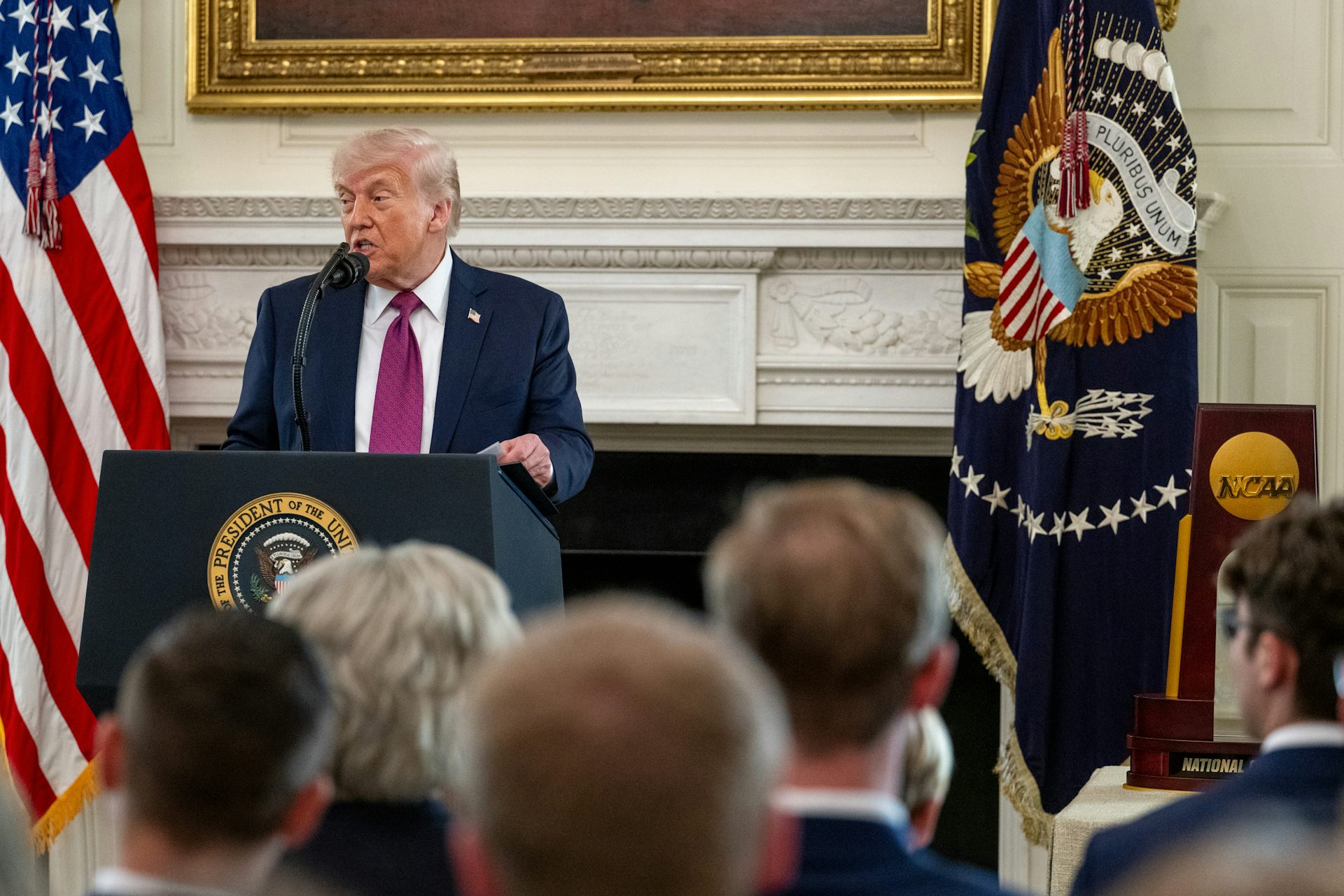 Donald Trump makes a speech at a podium in the White House, April  21 2026