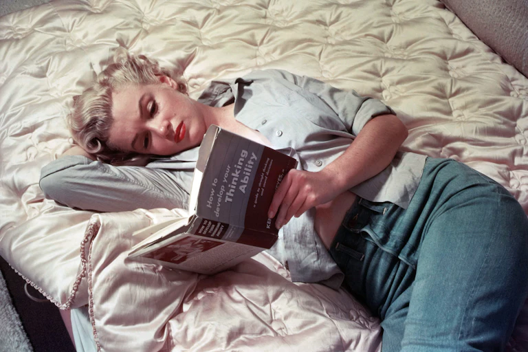 Monroe reading a book