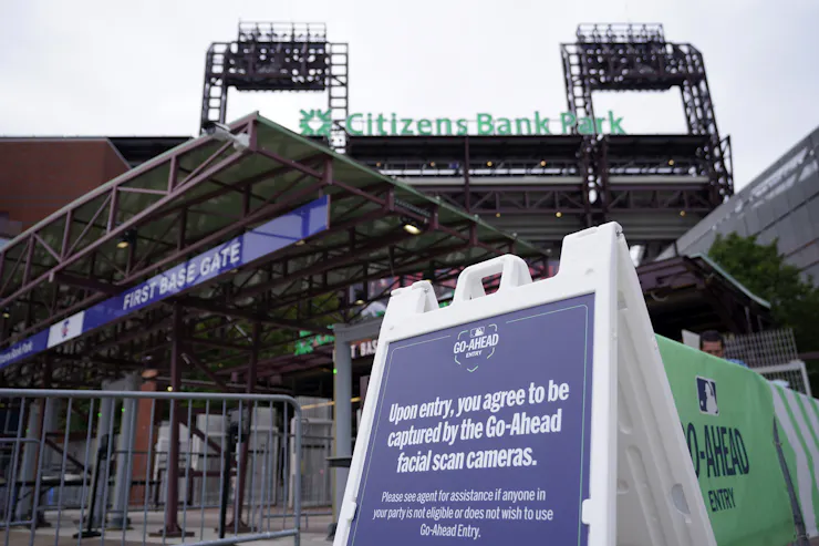 a sandwichboard sign outside a stadium