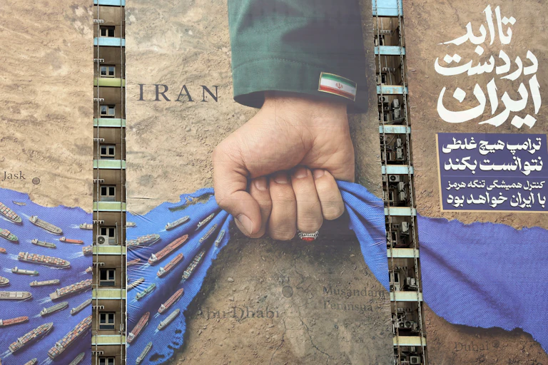 Billboard from Tehran showing Iran gripping the Strait of Hormuz.
