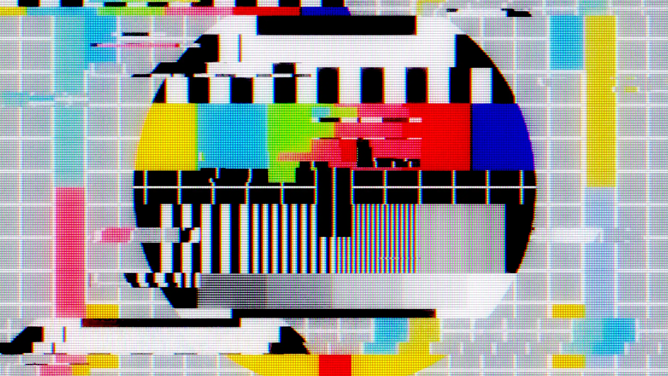 A vintage television test pattern showing a circle and a grid with colours, but glitching.