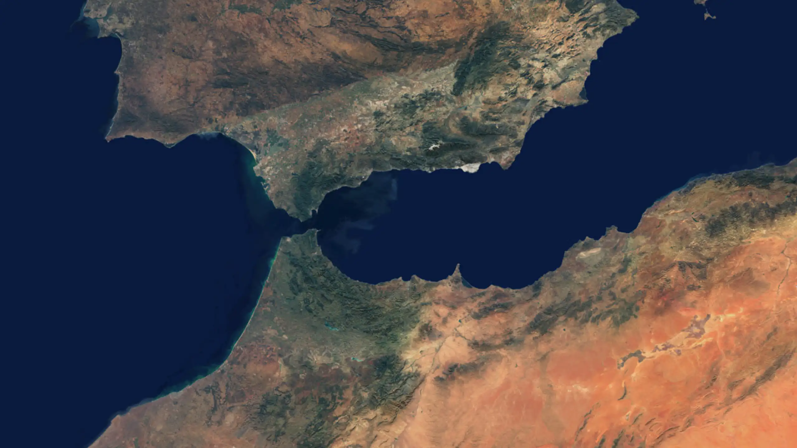 Satellite image of the western Mediterranean showing southern Iberia and northern Morocco, with the narrow Strait of Gibraltar between Africa and Europe.