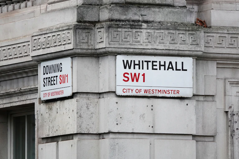 Street signs marking the junction of Whitehall and Downing Street