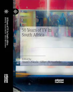 A book cover with a close-up of an illustration on a screen that's reflecting light.
