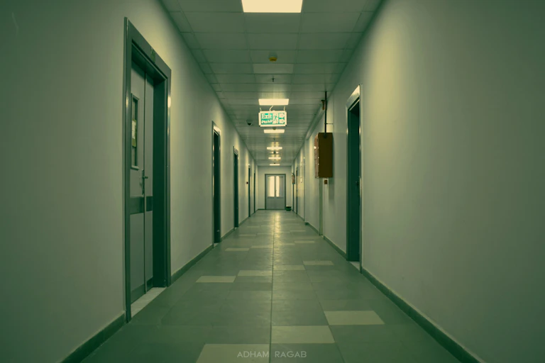 A dimly lit hospital corridor