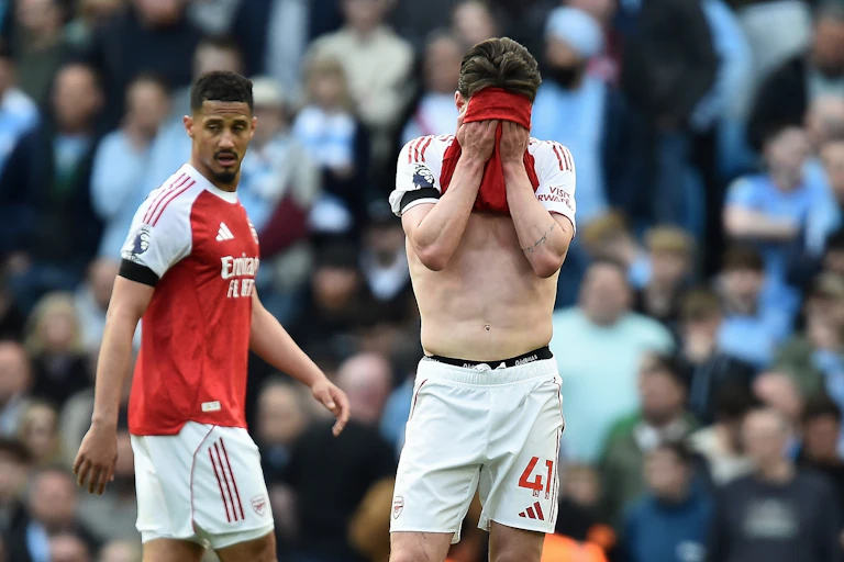 Arsenal's Declan Rice covers his face with his shirt during the match against Manchester City.