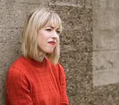 Introducing The Dialog Local weather Poetry Award – for UK-based teachers 3 blonde woman standing by wall with red jumper