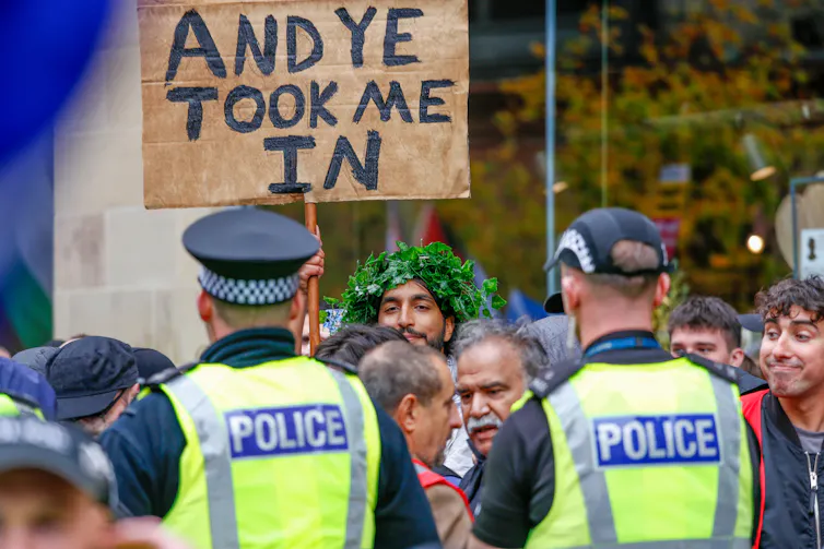 A protestor and policemen in Glasgow