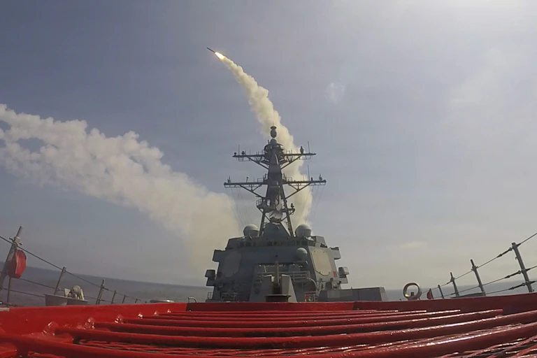 A ship fires a missile.