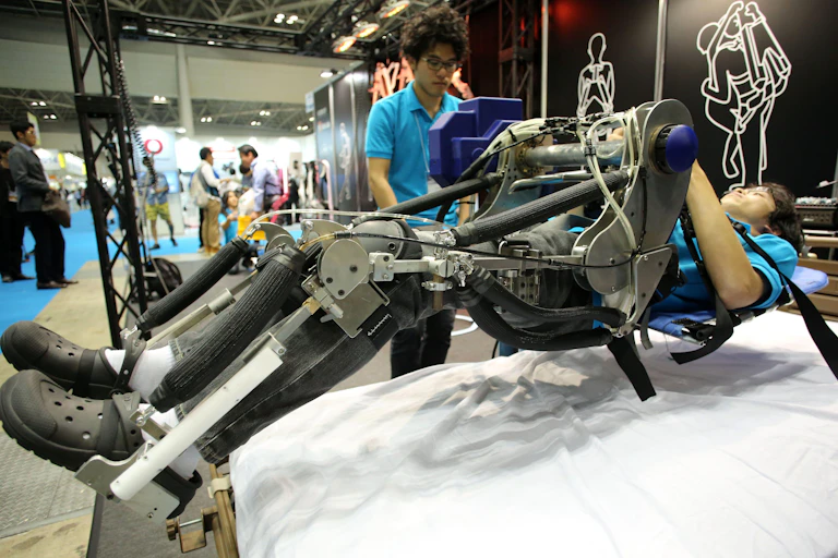 Tokyo University of Science researchers demonstrate a nursing care robot.
