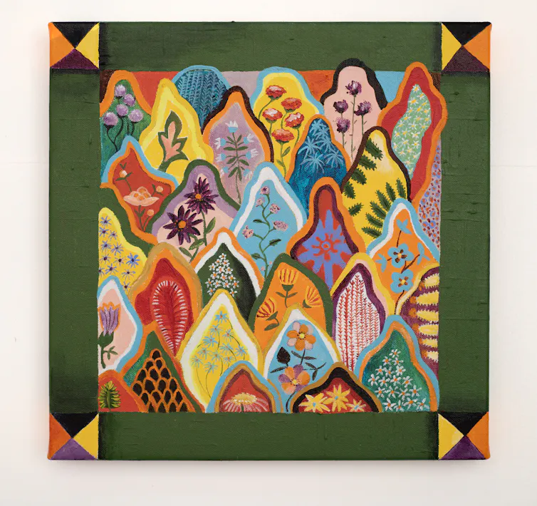A colourful tapestry with a green border