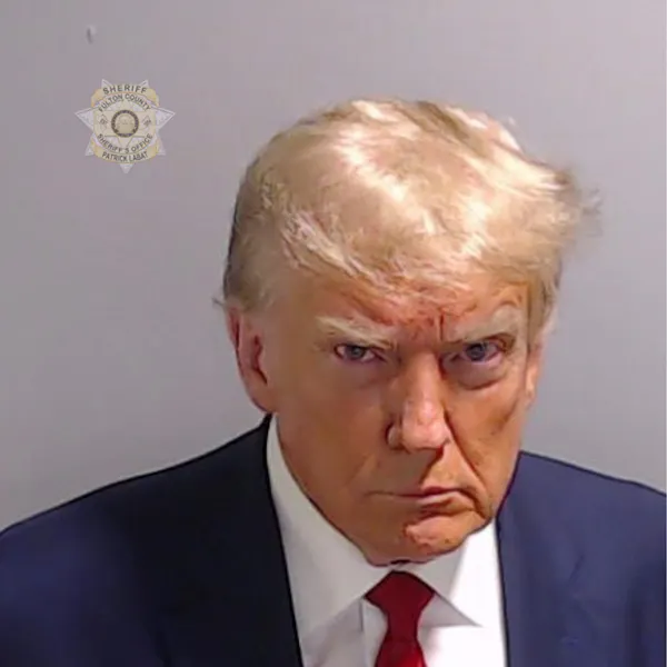 Mugshot of a man dressed in suit and tie.