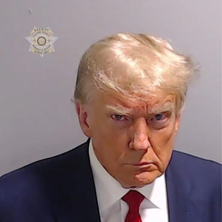 Mugshot of a man dressed in suit and tie.