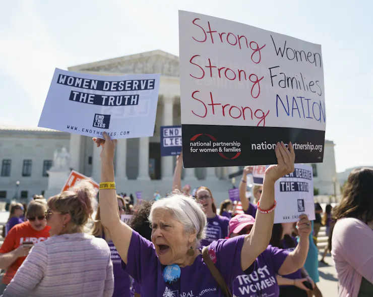 A woman who supports abortion rights protests outside the Supreme Court building.