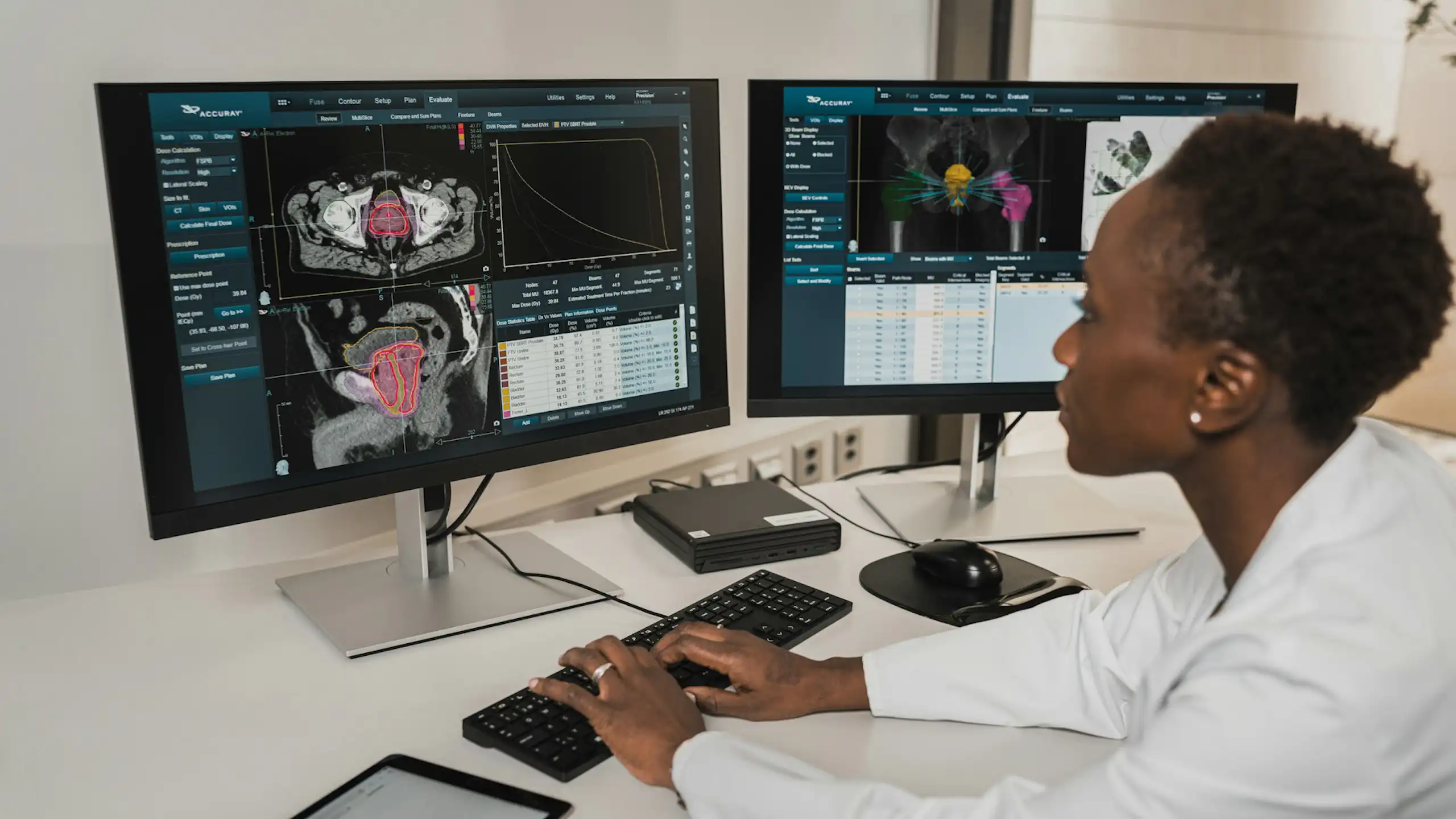 A woman sits at a computer examining medical tests results.