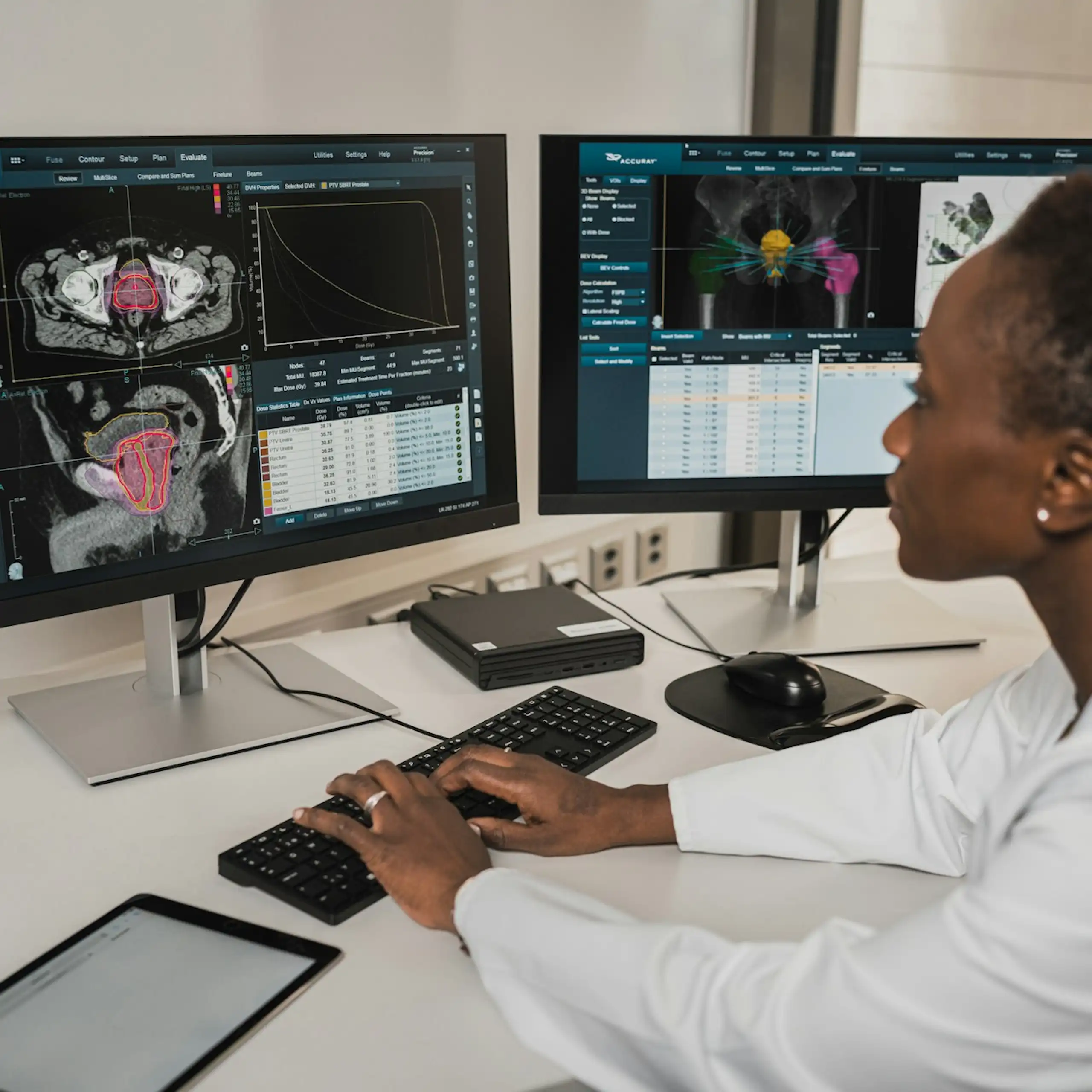 A woman sits at a computer examining medical tests results.