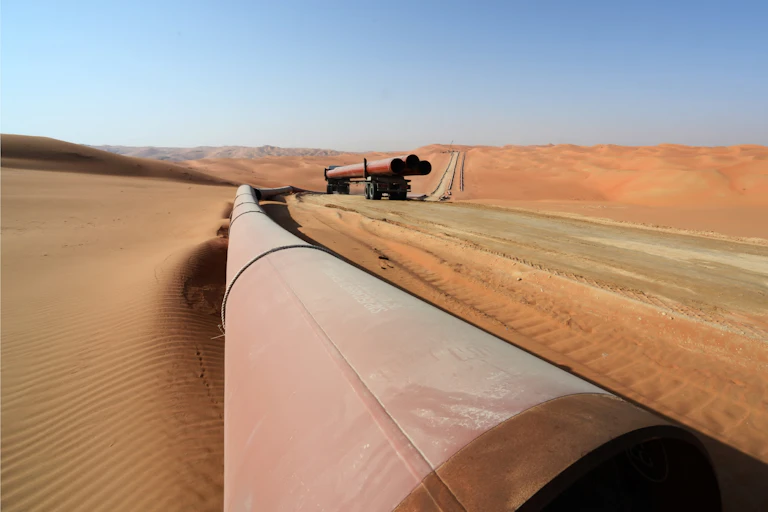 A pipeline running through a desert.
