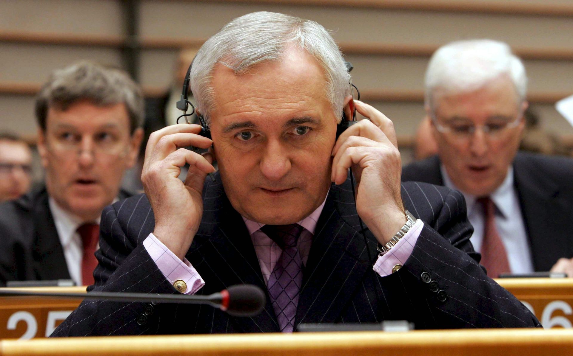 Bertie Ahern listening on headphones