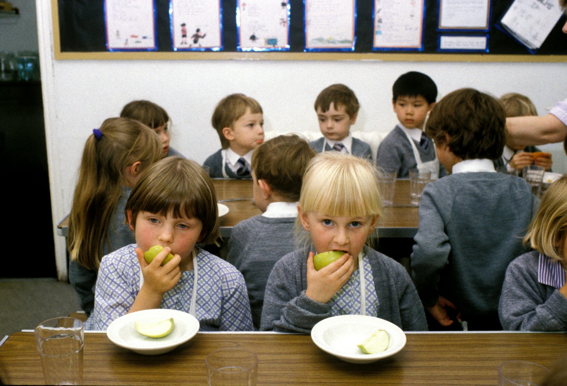 Kids eating apples.