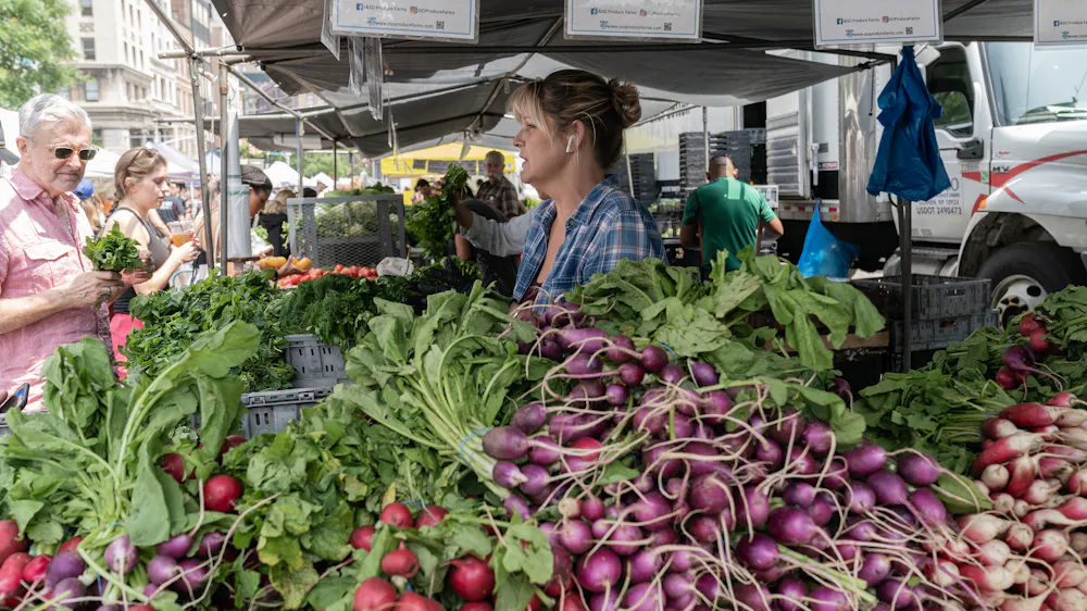 It’s not always a love of radishes that draws shoppers to these stalls.
Lev Radin/Pacific Press/LightRocket via Getty Images via The Conversation