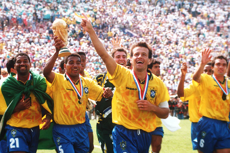 Members of the Brazilian national soccer team wave to the crowd after winning the USA 1994 World Cup.