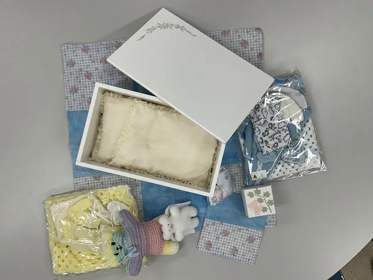 Coffin, clothes and toys made by volunteers to support parents during stillbirth.