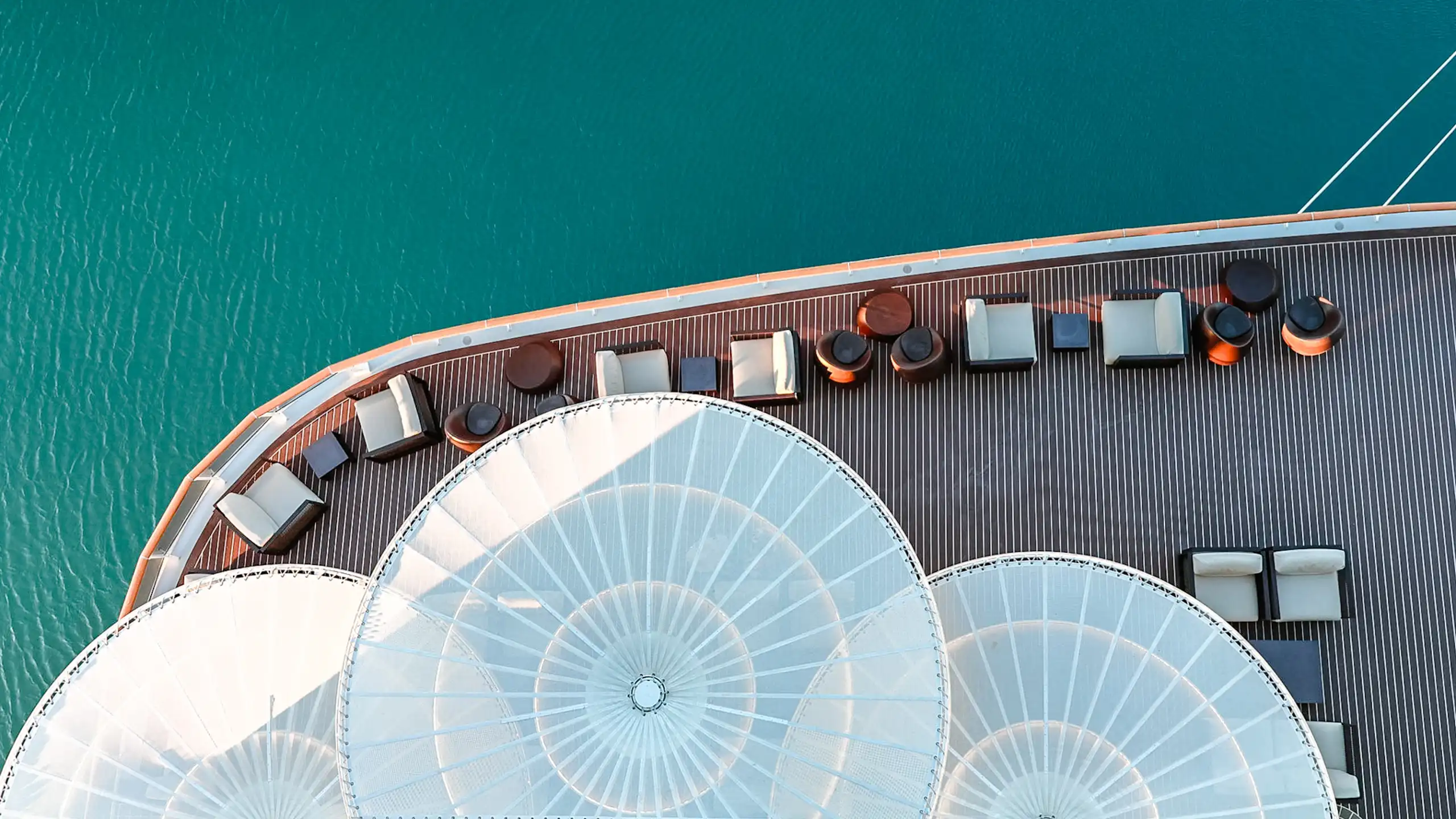 Part of the stern of a cruise ship, as seen from above.