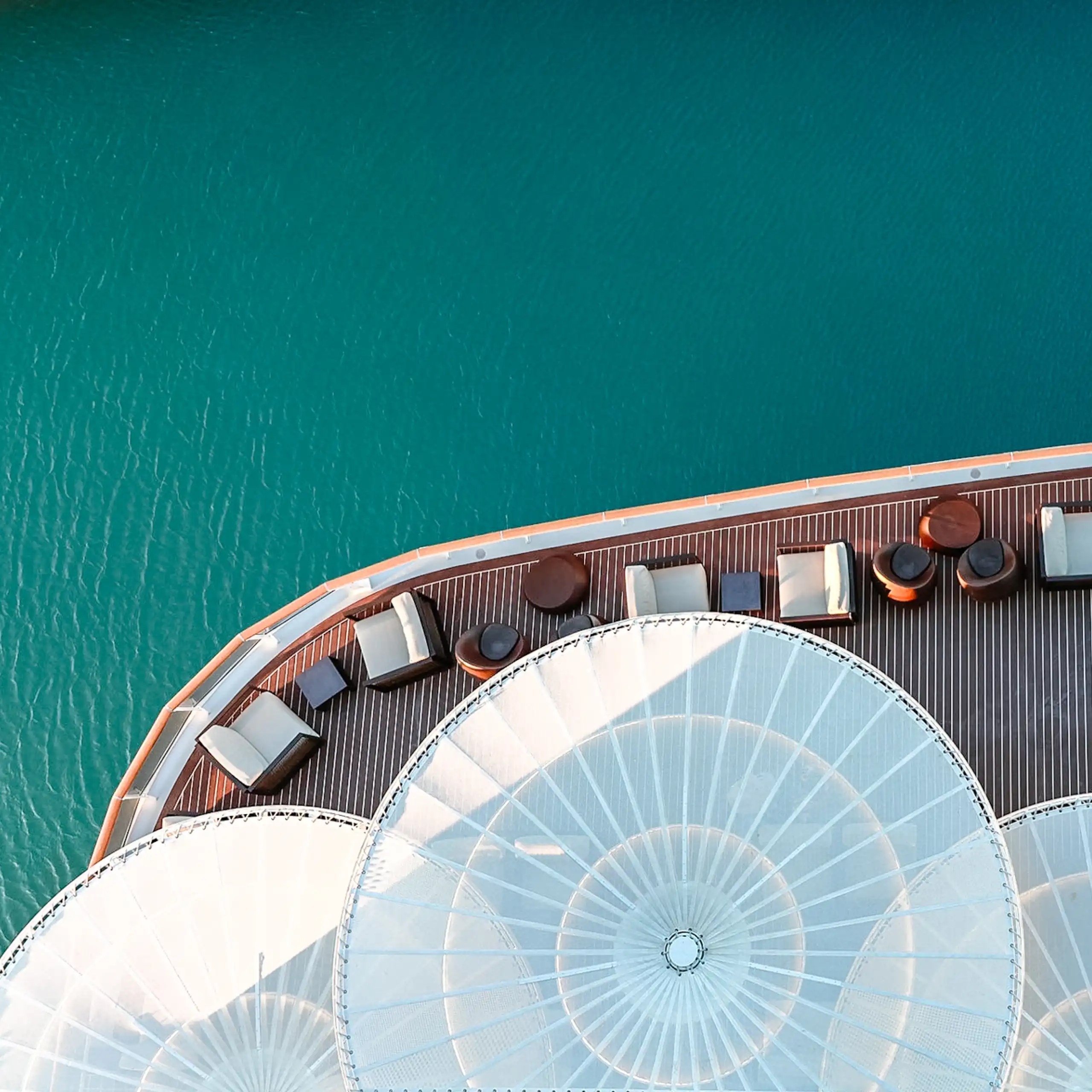 Part of the stern of a cruise ship, as seen from above.