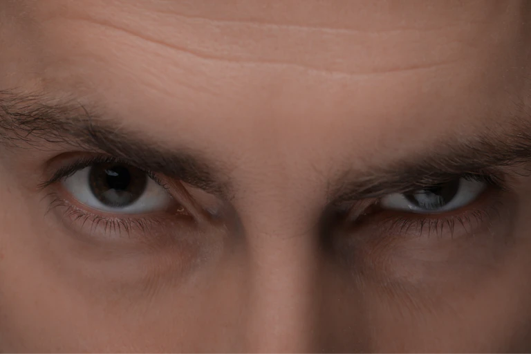 Man with scary eyes, closeup view.