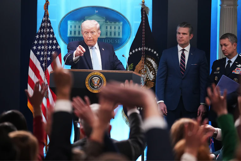 US president Donald Trump and his defense secretary Pete Hegseth and Dan Caine, chairman of the Joint Chiefs of Staff, at a press conference, April 6