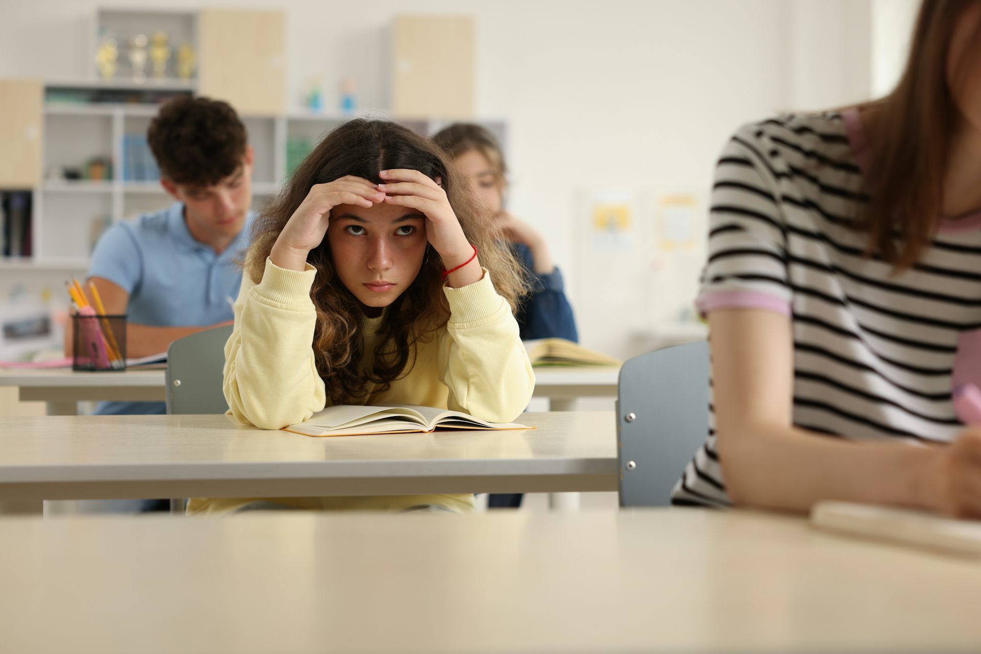 Girl looking worried in class