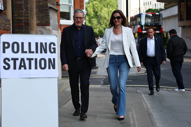 uk prime minister keir starmer and his wife arrive at a polling station for the 2026 english local elections