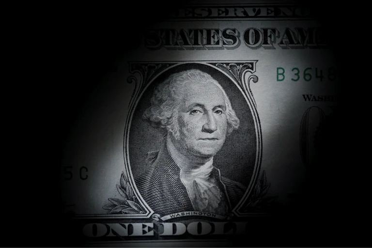 The likeness of George Washington is seen on a U.S. one dollar bill