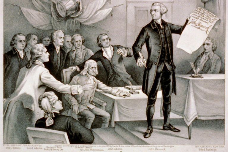 John Hancock brandishes a document bearing his large signature.