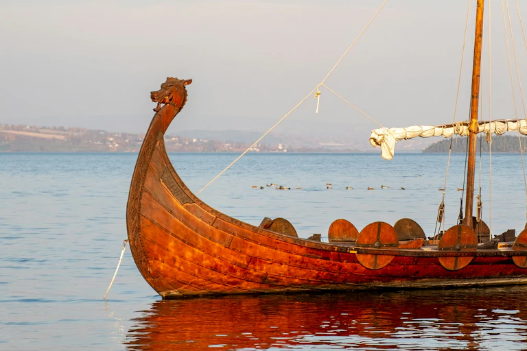 A Viking ship sits in the water.