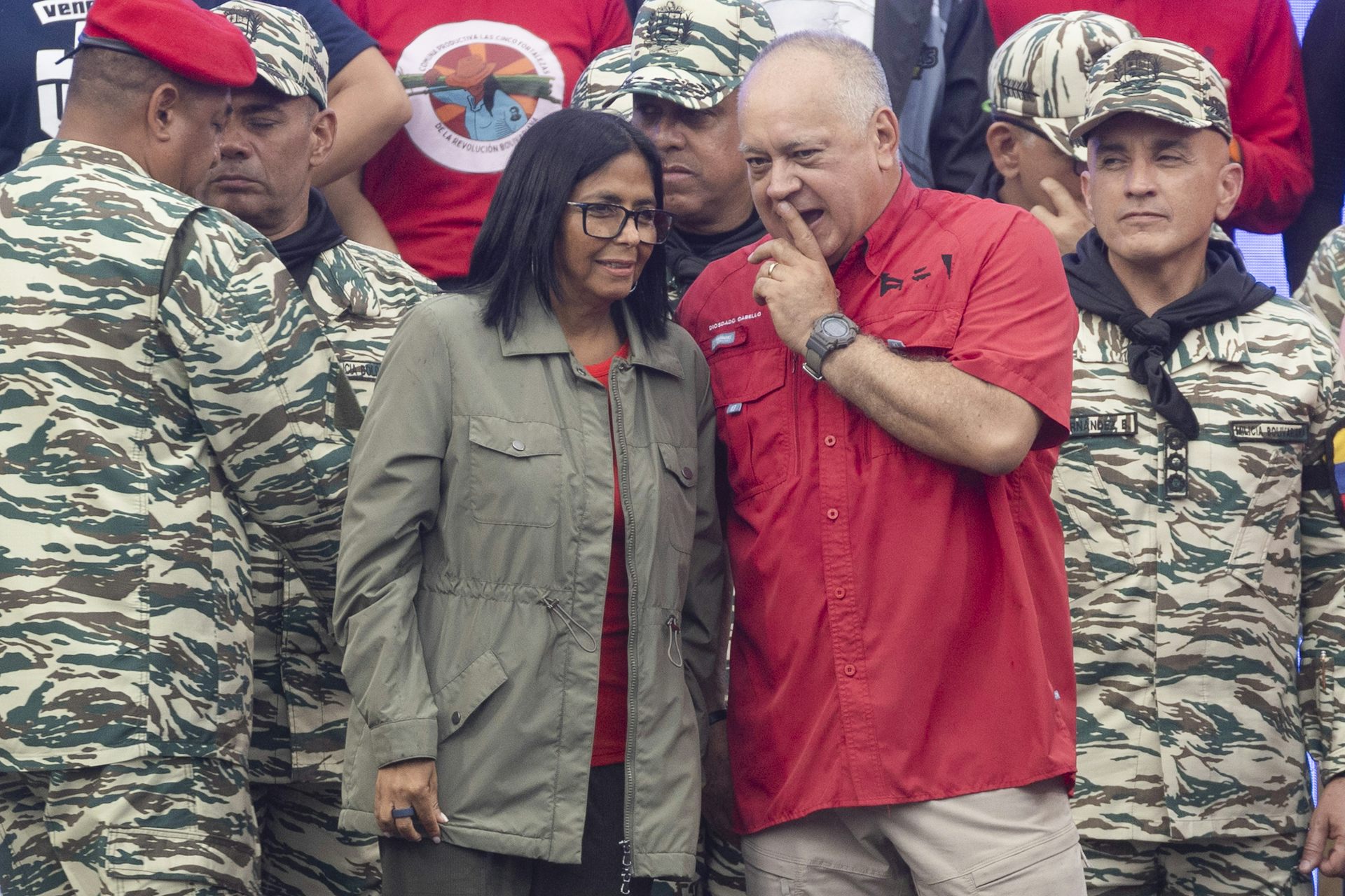 Delcy Rodriguez stands next to Diosdado Cabello at an event.