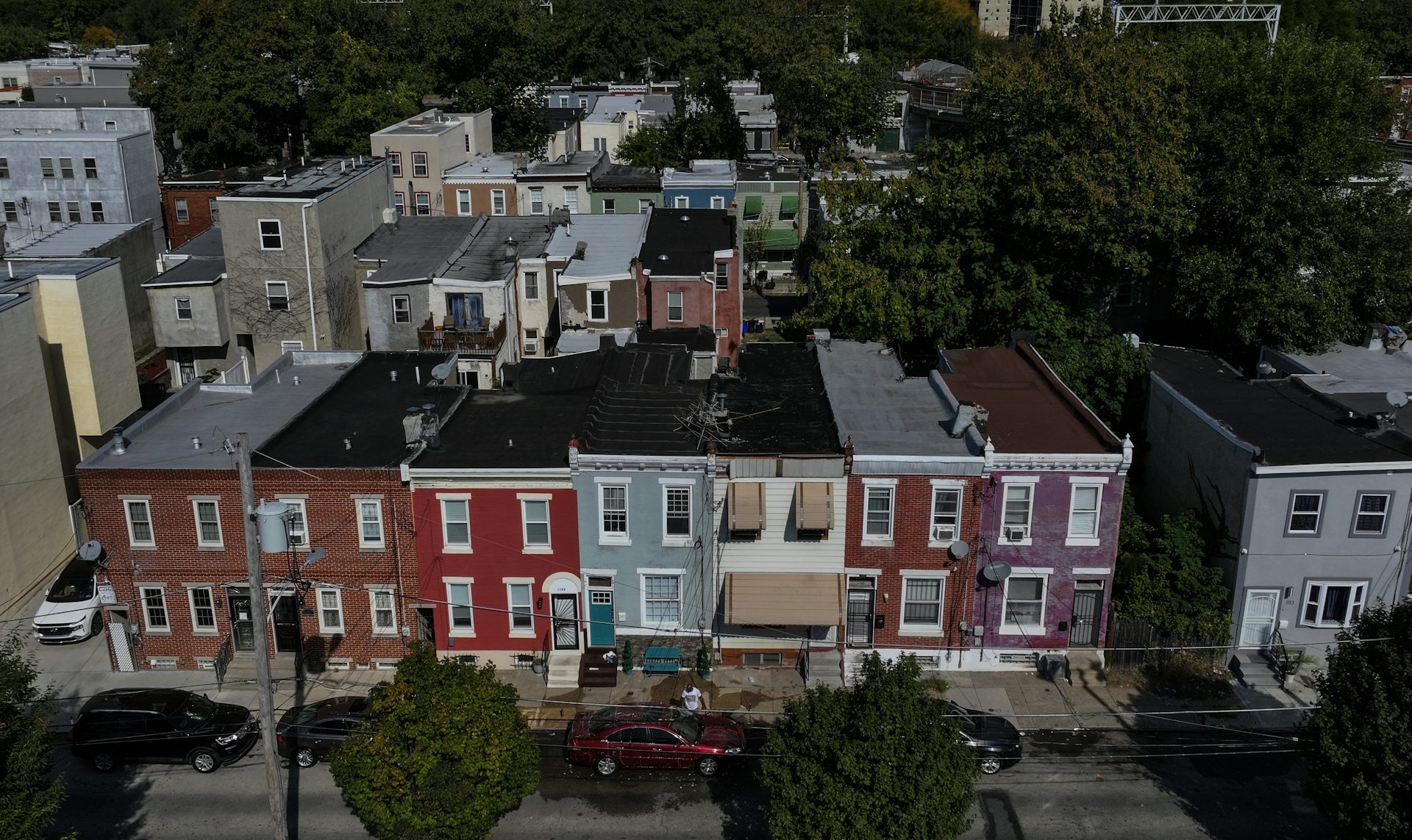 Aerial view of block of colorful two-story rowhomes