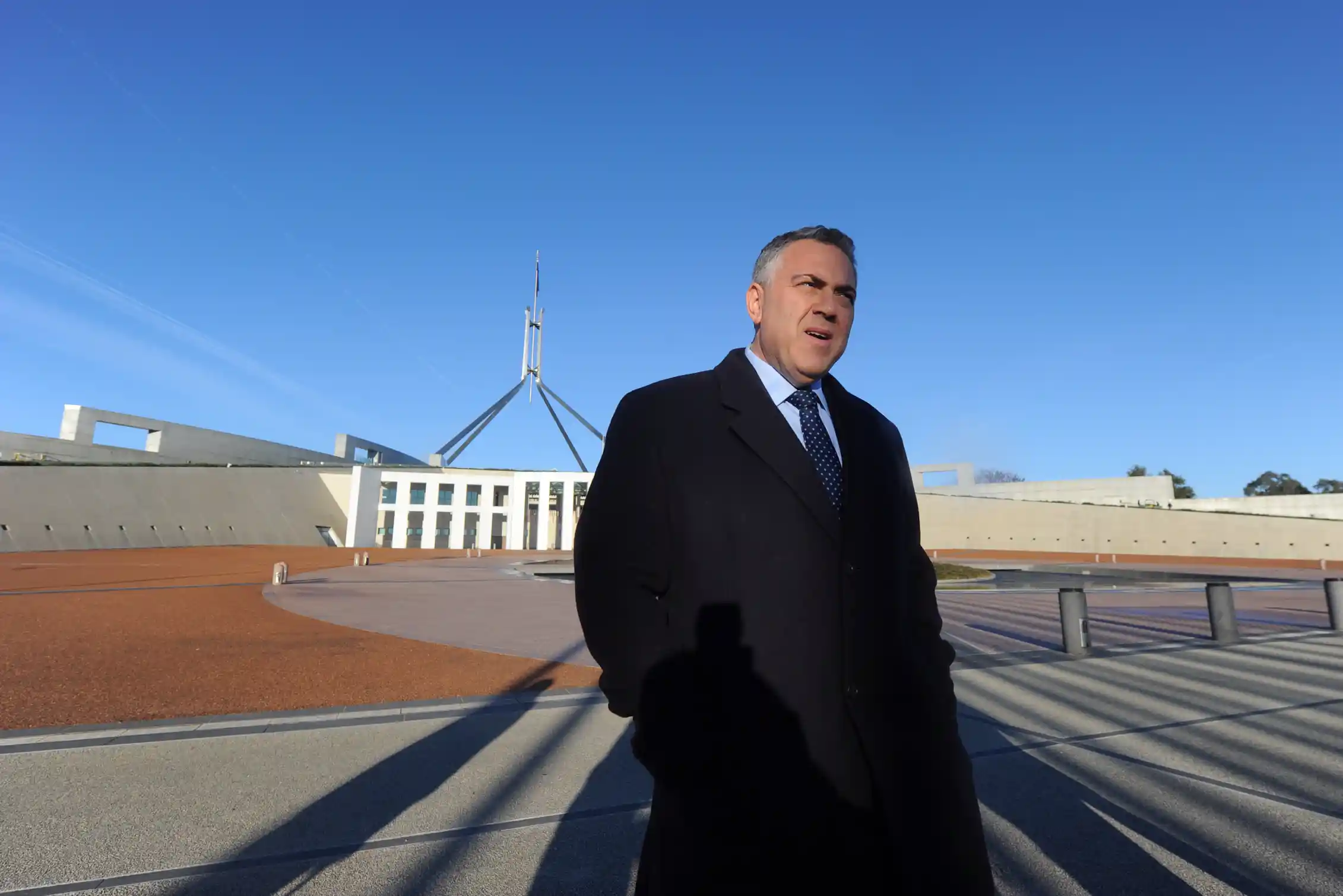 Federal Treasurer Joe Hockey arrives to speaks to the media outside Parliament House in Canberra,