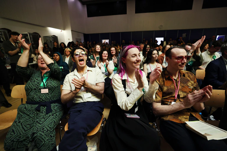 People cheering at an election count