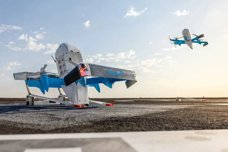 Two Amazon MK30 delivery drones pictured on a runway.