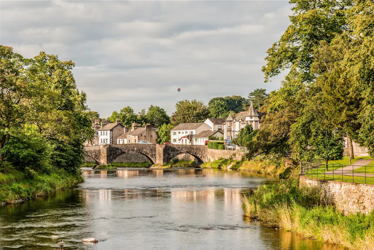 english river, olde bridge, green trees