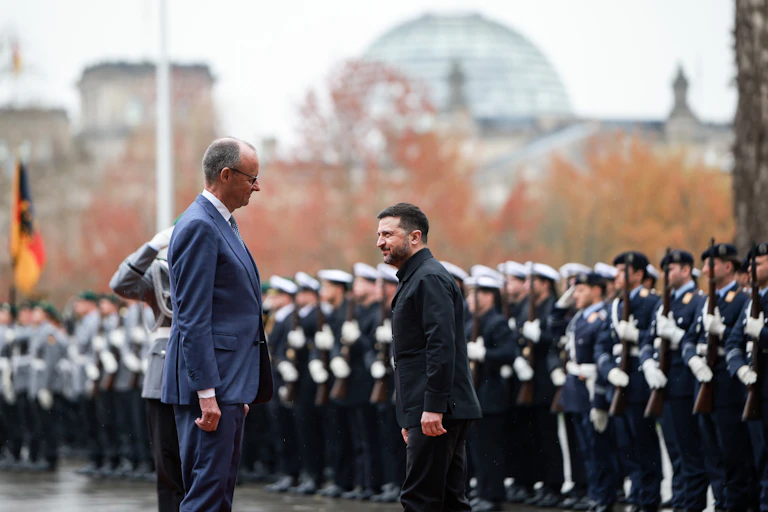 Friedrich Merz welcomes Volodymyr Zelensky to Berlin with a military guard of honour.