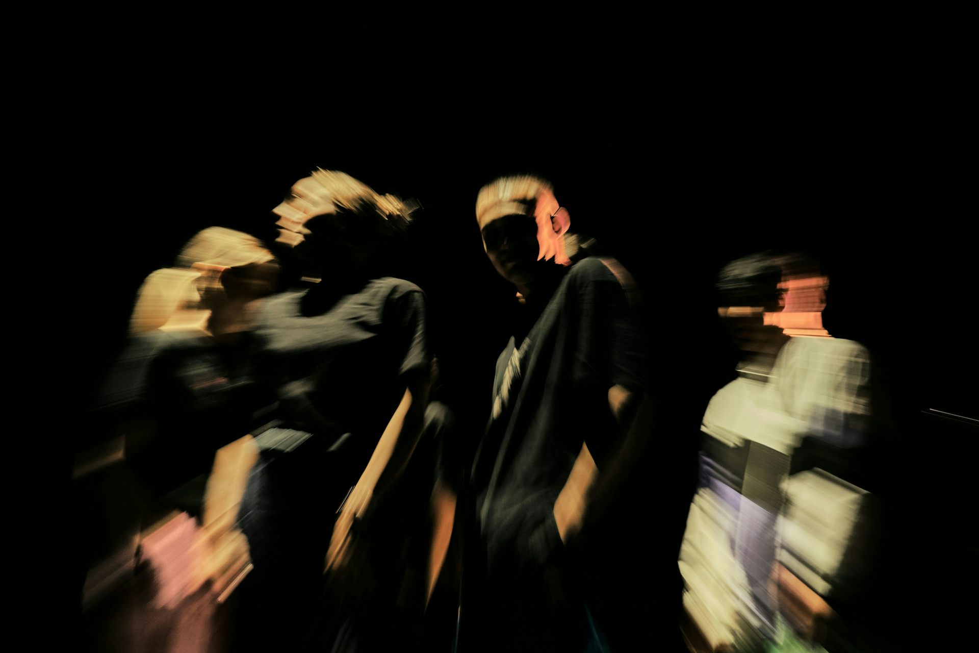 A blurred image of a group of teenagers.