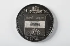 An old medal is shown.
