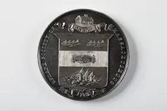 An old medal is shown.