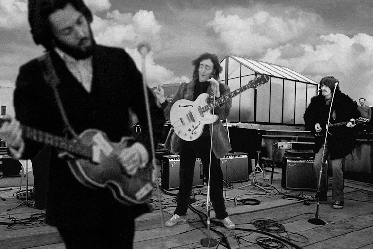 The Beatles playing their famous final gig on the roof of 3 Saville Row.
