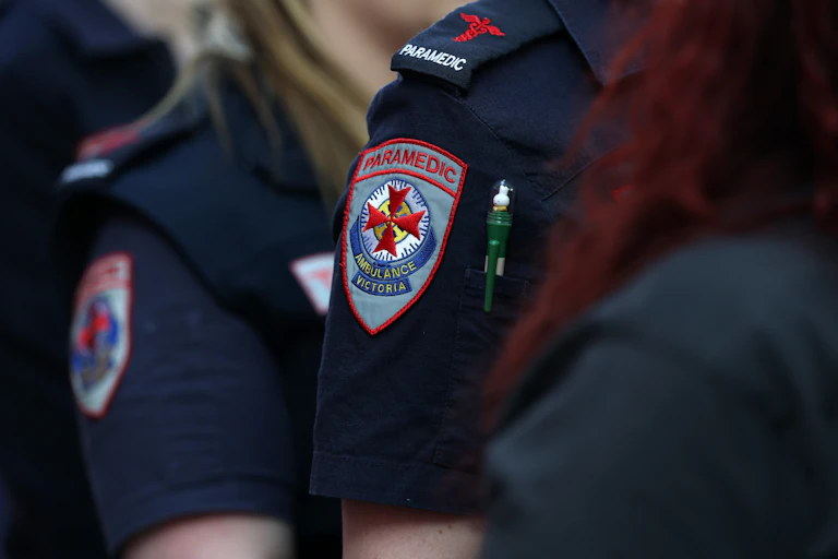 Close-up of an Ambulance Victoria badge, worn by a paramedic.