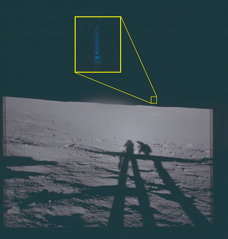 Lunar photo showing a small streak of light above the horizon.