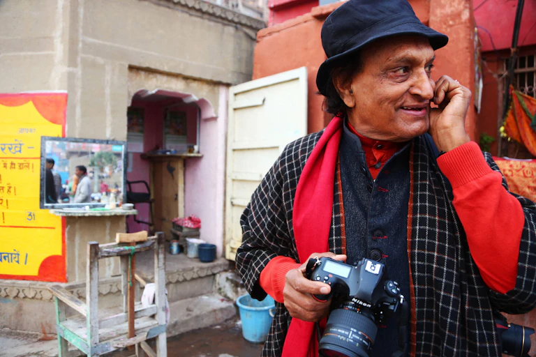 Raghu Rai with camera round his neck